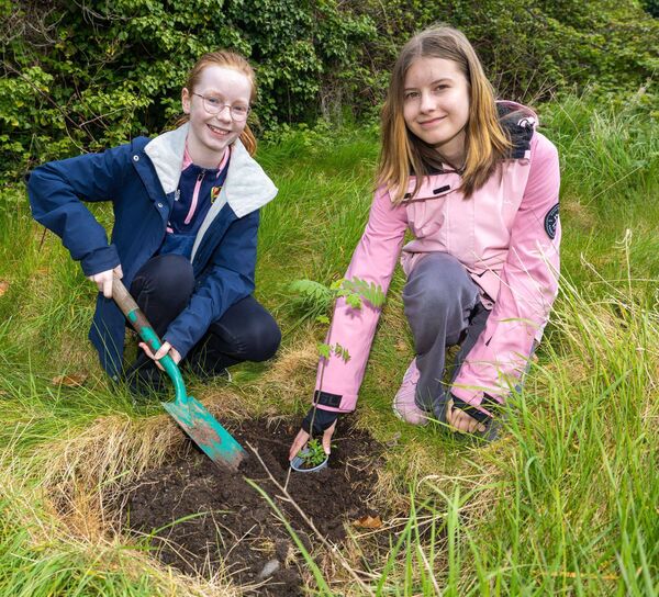 Laura Ashmore and Victoria Chokal from the Carlow NS plant a mountain ash tree Photos: Michael O'Rourke Photography 2026 