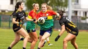 <p>Carlow’s Sara Doyle skips through the challenges from Kilkenny’s Emer Dunphy and Ellie Royce-Brennan Photo: © Michael O’Rourke Photography</p>