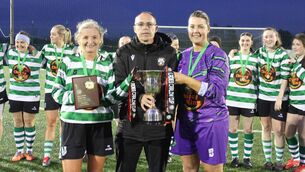 <p>Brian O'Reilly, League Secretary, presenting the Carlow Cup to winning captains Geraldine Norton and Margaret Nolan.</p>
