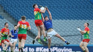 <p>Eoghan Ruth rises highest to catch a kickout over Dessie Reynolds from Longford during the Division 4 Final at Croke Park Photo: Pat Ahern</p>