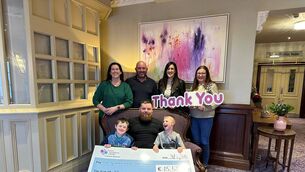 <p>John O'Brien, standing, and Jack Green, front, from Carlow Charity Pigeon Show presented a cheque to Olivia Flanagan, Tina McDonnell and Carol North from Carlow's Down Syndrome Ireland. Also pictured are Josh, left, sitting in front </p>