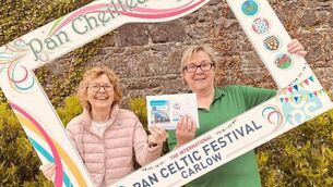 <p>Bríde de Róiste of the Pan Celtic International Festival with raffle winner Fidelma Morris</p>