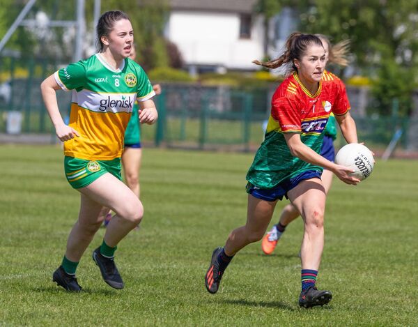 Carlow’s Ruth Bermingham races away from Offaly’s Meabh Rouse. 	Photos: Michael O’Rourke.
