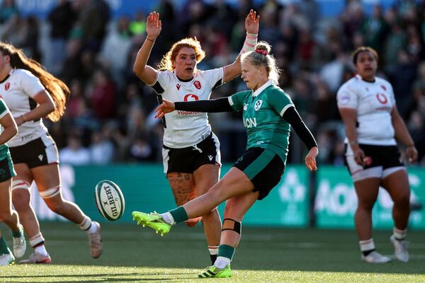 Wales' Georgia Evans tries to block down Dannah O’Brien's kick. Photo: INPHO. Wales' Georgia Evans tries to block down Dannah O’Brien's kick. Photo: INPHO.