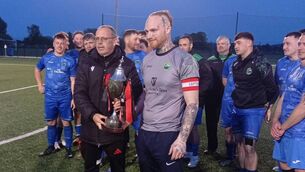 <p>Slaney Rovers are presented with the Tully's Travel Division 1 trophy</p>
