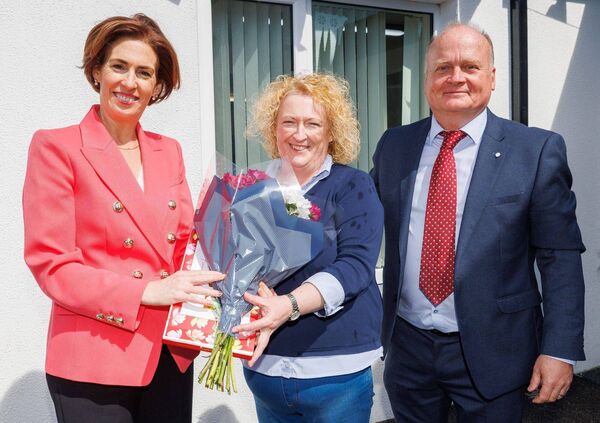Minister Naughton makes a presentation to school liaison officer Jenny Healy, along with principal Fergal Browne Minister Naughton makes a presentation to school liaison officer Jenny Healy, along with principal Fergal Browne