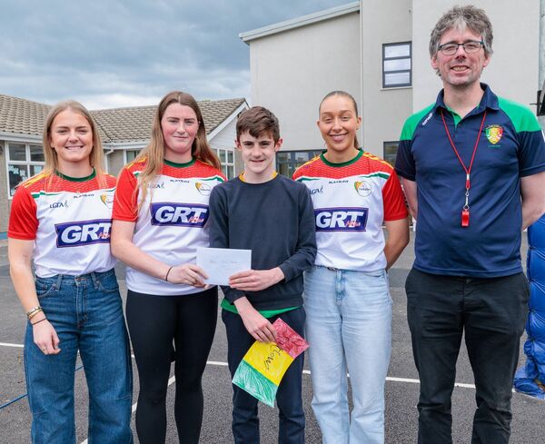 Sixth class pupil Jack McGrath on behalf of the school makes a contribution to Carlow LGFA, shown are Carlow stars Sara Doyle, Aibha Kiernan-Butler and Róisín Bailey and Shane Byrne (teacher) Sixth class pupil Jack McGrath on behalf of the school makes a contribution to Carlow LGFA, shown are Carlow stars Sara Doyle, Aibha Kiernan-Butler and Róisín Bailey and Shane Byrne (teacher)