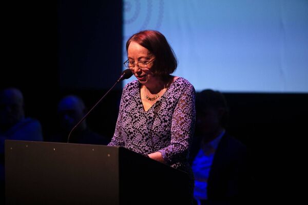 Ann Irwin reads her winning entry 