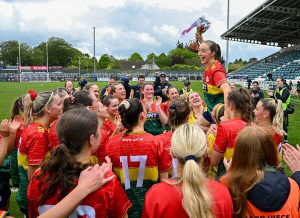 Captain Roisin Bailey and her Carlow team celebrate with the TG4 Leinster Ladies Football Junior Championship title. Photo: Ramsey Cardy/Sportsfile.