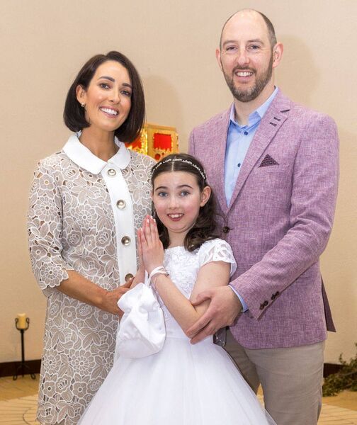 Evie McLoughlin with her parents, Aideen and Gareth