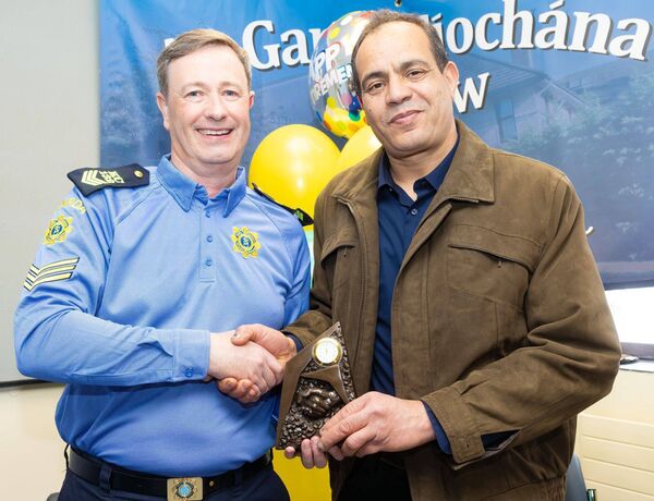 Ahmed Ghirfani on behalf of the Carlow Islamic Cultural Centre makes a presentation to Sergeant Egan Ahmed Ghirfani on behalf of the Carlow Islamic Cultural Centre makes a presentation to Sergeant Egan
