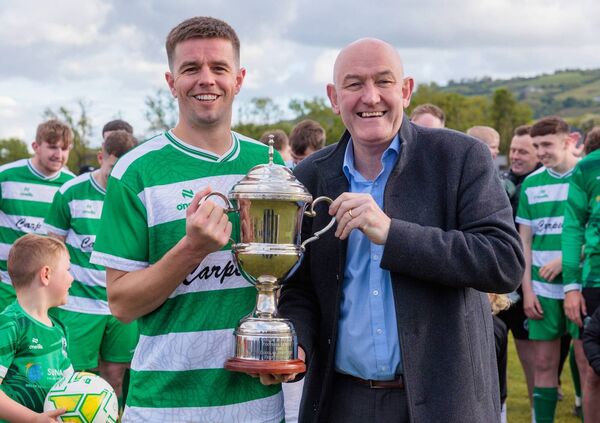 Ivan Tucker presents the Douglas Jewellers Carlow Cup to New Oak captain David O’Shea. All Photos: Michael O'Rourke.