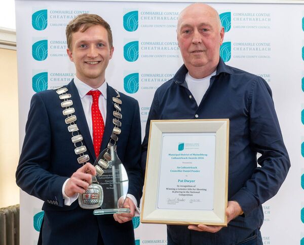 Cllr Daniel presents an award to Pat Dwyer Cllr Daniel presents an award to Pat Dwyer