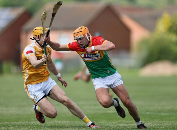 Jake Nolan takes on Antrim captain Niall O'Connor. All Photos: Pat Ahern Jake Nolan takes on Antrim captain Niall O'Connor. All Photos: Pat Ahern
