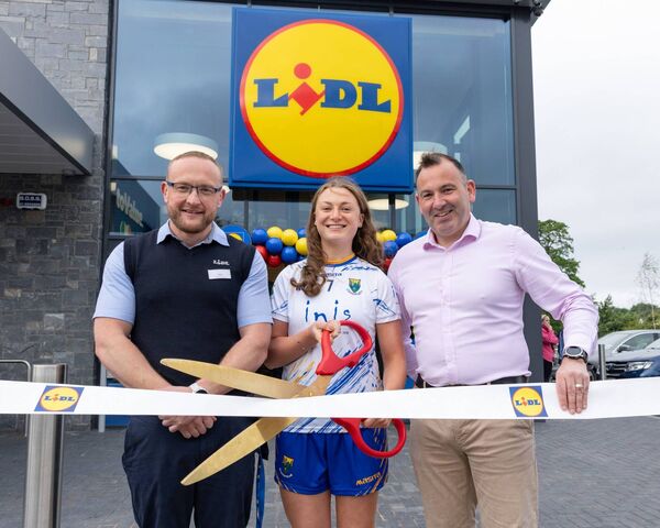 Baltinglass footballer, Ella Park officially cuts the ribbon on Lidl's new store in Baltinglass, with local manager, Mark Shannon and Niall Murray, Regional Managing Director at Lidl Ireland