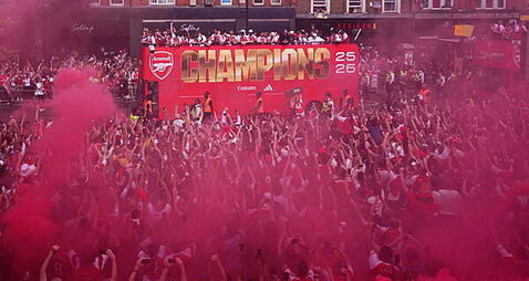 Arsenal put Champions League defeat behind them with open-top bus parade