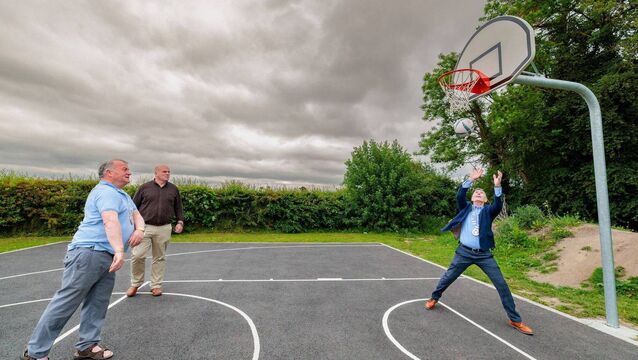 <p>Council executive engineer Ciaran Brennan looks on as cllr Ken Murnane and cllr Paul Doogue try out the basketball court during the official reopening of Oak Park Forest Park Photo: Michael ORourke Photography</p>
