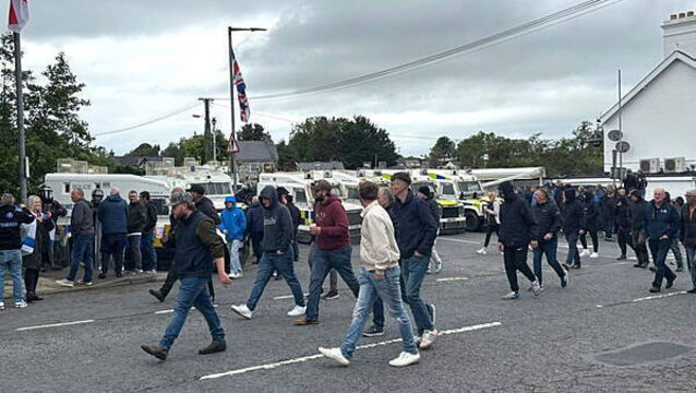 DUP MP defends photo with masked men at Scarva protest