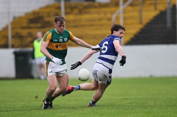 Rathvilly's Kevin Murphy and Tinryland's Niall Lowry batttle for the ball in Netwatch Cullen Park on Sunday evening. Photos: Pat Ahern.
