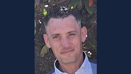 Two men accused of murder seen throwing golf clubs over a wall