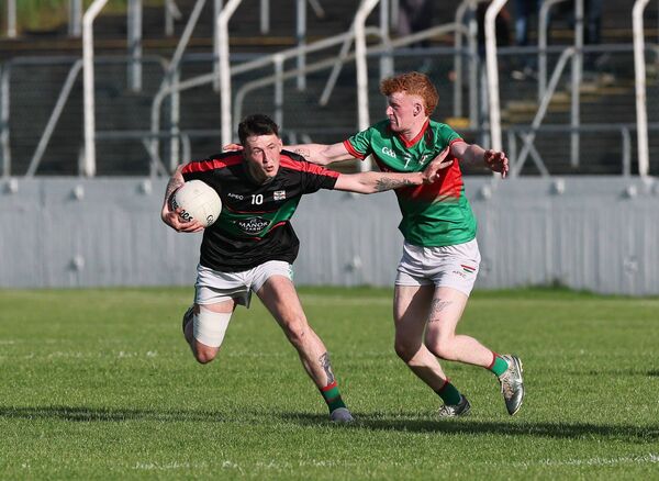 Kilbride's Rian Farrell battles with Clonmore's Lee Doyle. Kilbride's Rian Farrell battles with Clonmore's Lee Doyle.