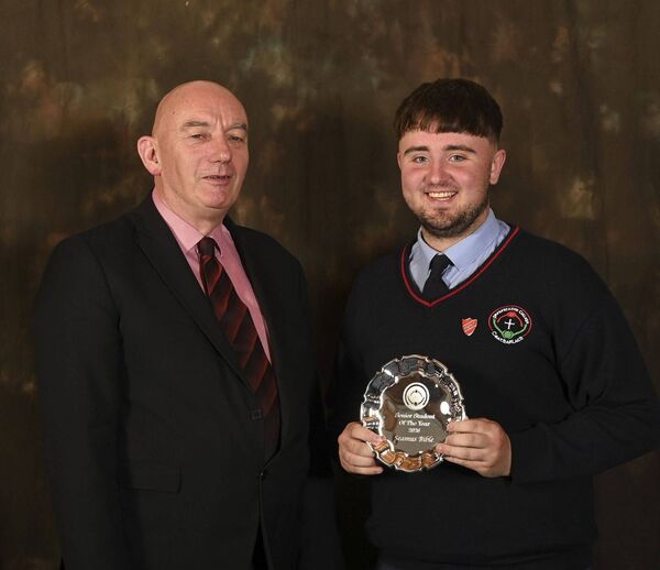 Seamus Bible being presented by principal Ray Murray with the senior student of the year 