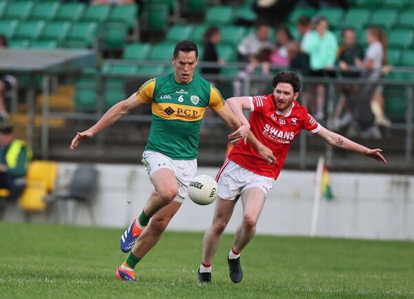 Rathvilly's Brendan Murphy gets away from Eire Og's Evan Kelly before raising the first of his two orange flags. Rathvilly's Brendan Murphy gets away from Eire Og's Evan Kelly before raising the first of his two orange flags.