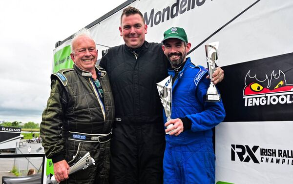 Kevin McGrath celebrates with Des Bruton [left] and Dave Reynolds [right] at Mondello Park.
