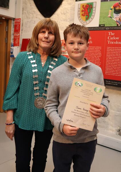 James George with his certificate alongside Helen Doyle, president of CHAS
