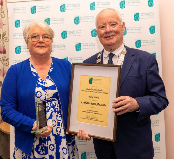 Cllr John Pender presents singer Regina Hanley with an award Cllr John Pender presents singer Regina Hanley with an award