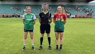 <p>London captain, Niamh Crowley, referee Colm Conway, and Carlow caprain Róisin Bailey before throw-in at McGovern Park, Ruislip. Photo: Damian Dolan.</p> <p>London captain, Niamh Crowley, referee Colm Conway, and Carlow caprain Róisin Bailey before throw-in at McGovern Park, Ruislip. Photo: Damian Dolan.</p>