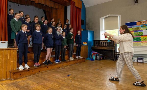 Music teacher Alison Behan directs fifth class pupils