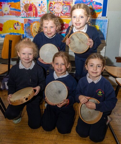 Senior infants learning to play the tambourine 