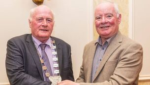 <p>Cllr Charlie Murphy, newly-elected cathaoirleach of Tullow Municipal District, accepts the chain of office from outgoing chair cllr John Pender (right) in Mount Wolseley Hotel in Tullow Photo: Michael O'Rourke Photography</p>