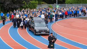 <p>The final journey of St Laurence O'Toole AC stalwart PL Curran as his funeral cortege makes two laps of the club's Olympic-standard running track that he was instrumental in creating Photo: Michael O'Rourke Photography</p>
