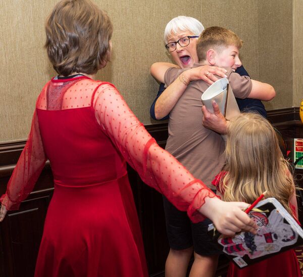Pauline Smith gets a hug from her grandson Andrew Smith during her surprise 70th birthday party in the Seven Oaks Hotel Photos: Michael O'Rourke Photography