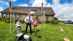 <p>Minister James Browne and Holly aged 6 and Maria aged 11 from the Sweeney Family at their family home in Ardee Co.Louth. Pic: Marc O'Sullivan</p>