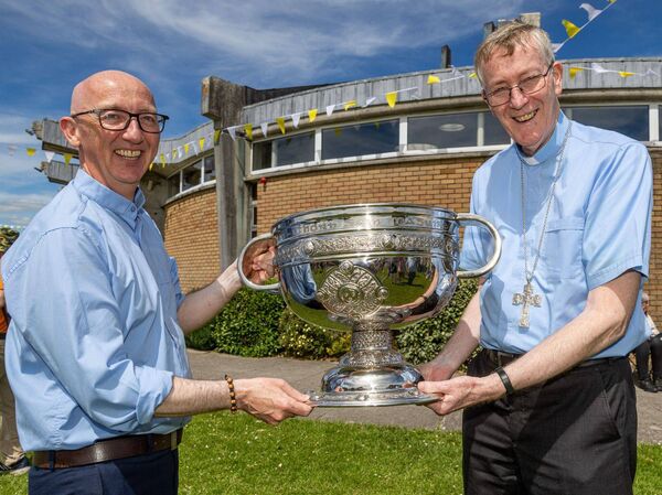 The Sam Maguire cup was in safe hands with Bishop Denis Nulty, right, and Fr Liam Morgan during the parish picnic The Sam Maguire cup was in safe hands with Bishop Denis Nulty, right, and Fr Liam Morgan during the parish picnic