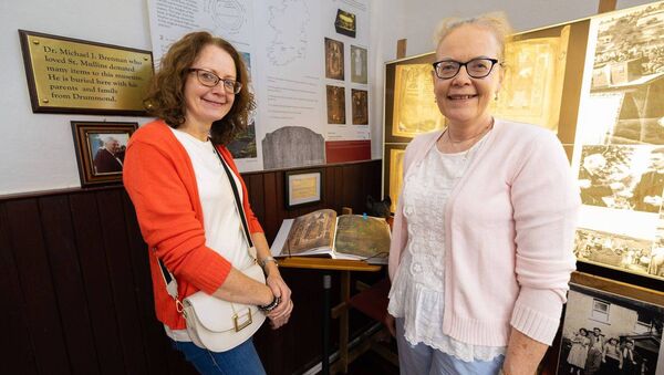 Geraldine Collier and Elizabeth Hayden pictured beside a copy of the 'Book of Mulling' (the original is in Trinity College)