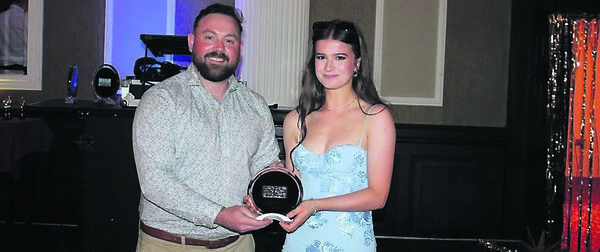 Grace Byrne receiving the academic achievement ward from TY co-ordinator, Jamie Walsh
