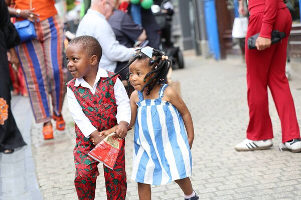 Kids enjoying the Nigerian festival of music and fashion Photo: Arnie McEvoy