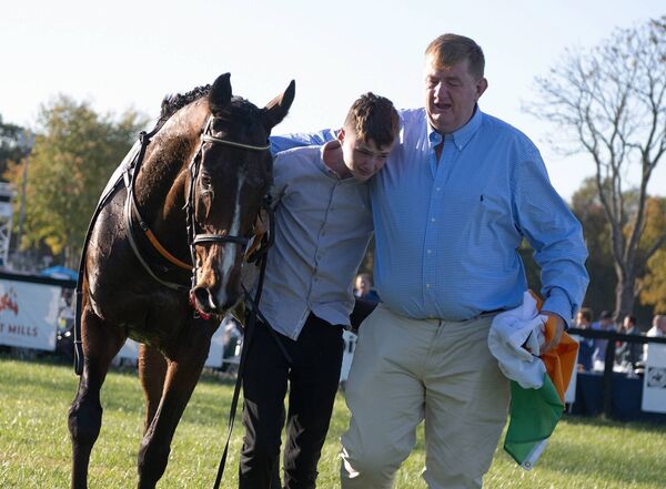 Trainer Shark Hanlon and son Paddy with Hewick after Grand National Photo: © 2022 Tod Marks/National Steeplechase Association. 