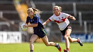 <p>Derry's Kate Hargan can't keep pace with Carlow forward Sara Doyle </p>