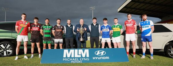 County chairman John McDonald with the Nationalist Cup, sponsors Michael Lyng Motors and representatives from the Senior Football Championship Clubs Photo: Pat Ahern