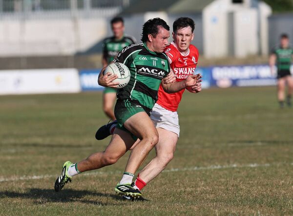Éire Óg's Adam Nolan goes stride for stride with Jamie Clarke of Bagenalstown Gaels. All Photos: Pat Ahern. Éire Óg's Adam Nolan goes stride for stride with Jamie Clarke of Bagenalstown Gaels. All Photos: Pat Ahern.