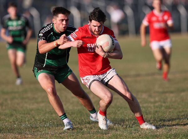 Bagenalstown Gaels' Niall Bolger gets in a strong tackle on Éire Óg's Cathal Kelly. Bagenalstown Gaels' Niall Bolger gets in a strong tackle on Éire Óg's Cathal Kelly.