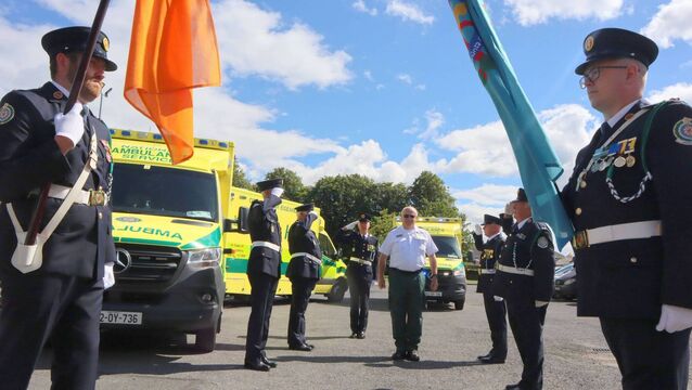 <p>The colour party salutes Martin Byrne's 40 years with the National Ambulance Service Photos: Paul Curran</p>