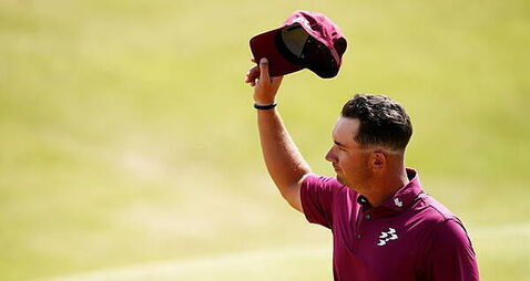 Lucas Herbert leads Open after equalling record for lowest score at men’s major