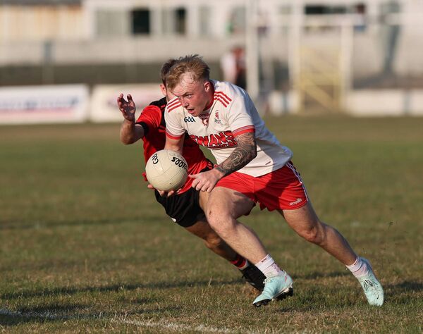 Ivan Murphy powers up the pitch for Éire Óg. Ivan Murphy powers up the pitch for Éire Óg.