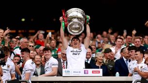 <p>Mayo's Sam Callinan lifts the Sam Maguire Photo: ©INPHO/James Crombie</p>